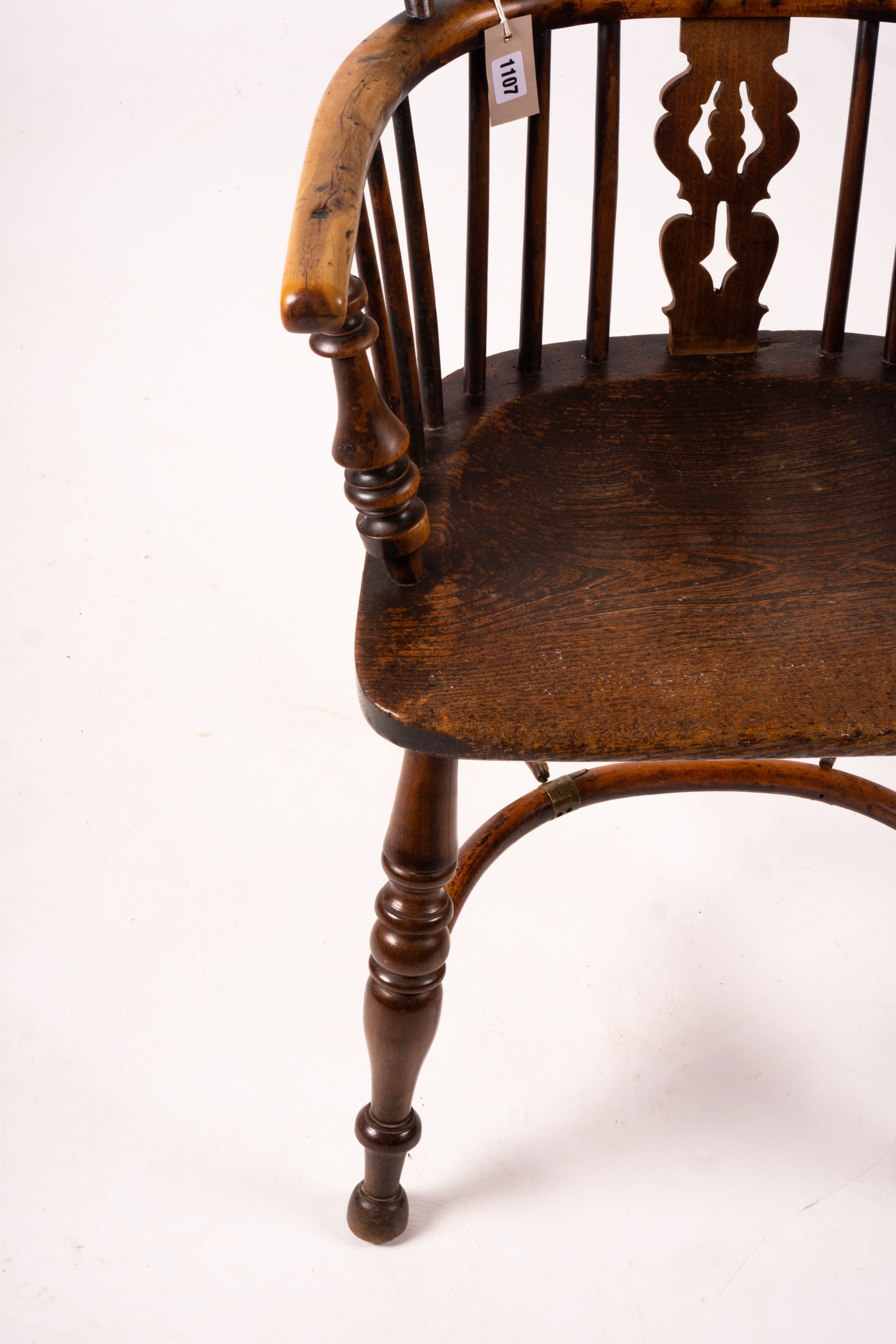 A 19th century yew and elm Yorkshire area Windsor elbow chair with crinoline stretcher, width 60cm, depth 45cm, height 93cm